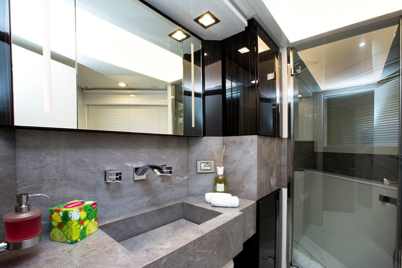 a bathroom with a large mirror aboard SONNY II Yacht for Sale