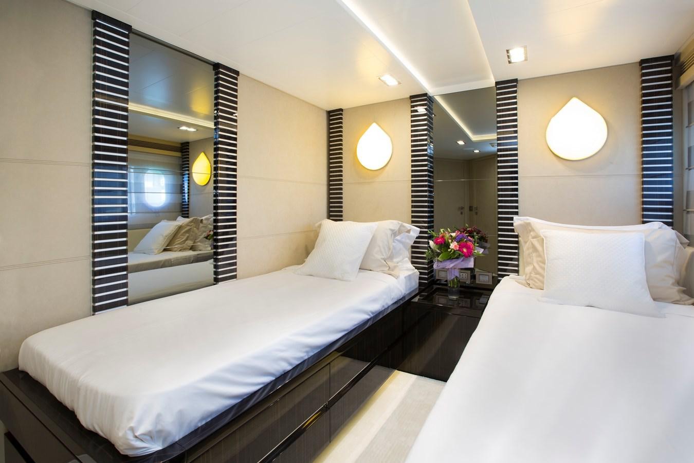 a hotel room with a large bed aboard SONNY II Yacht for Sale