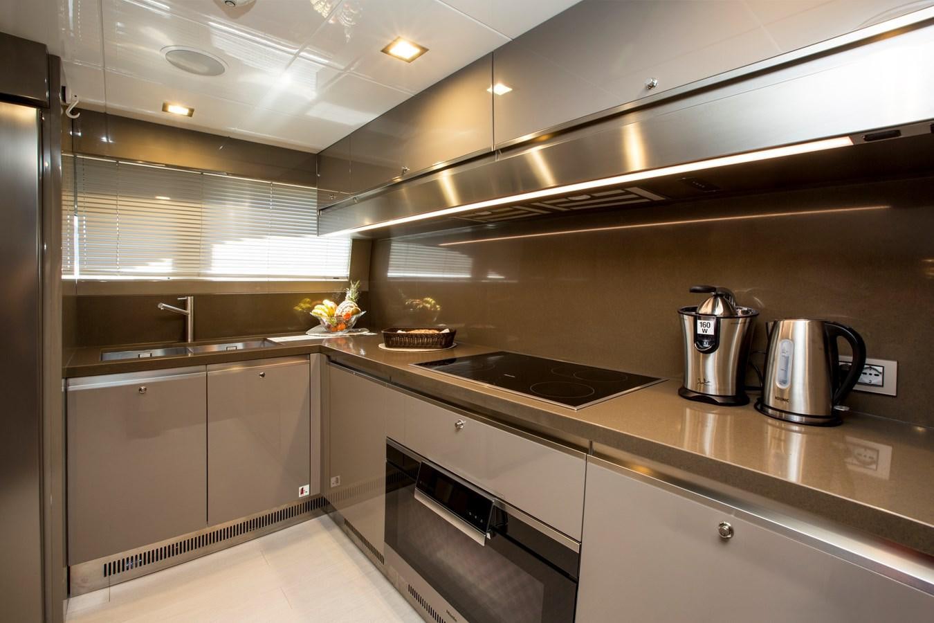 a kitchen with stainless steel appliances aboard SONNY II Yacht for Sale
