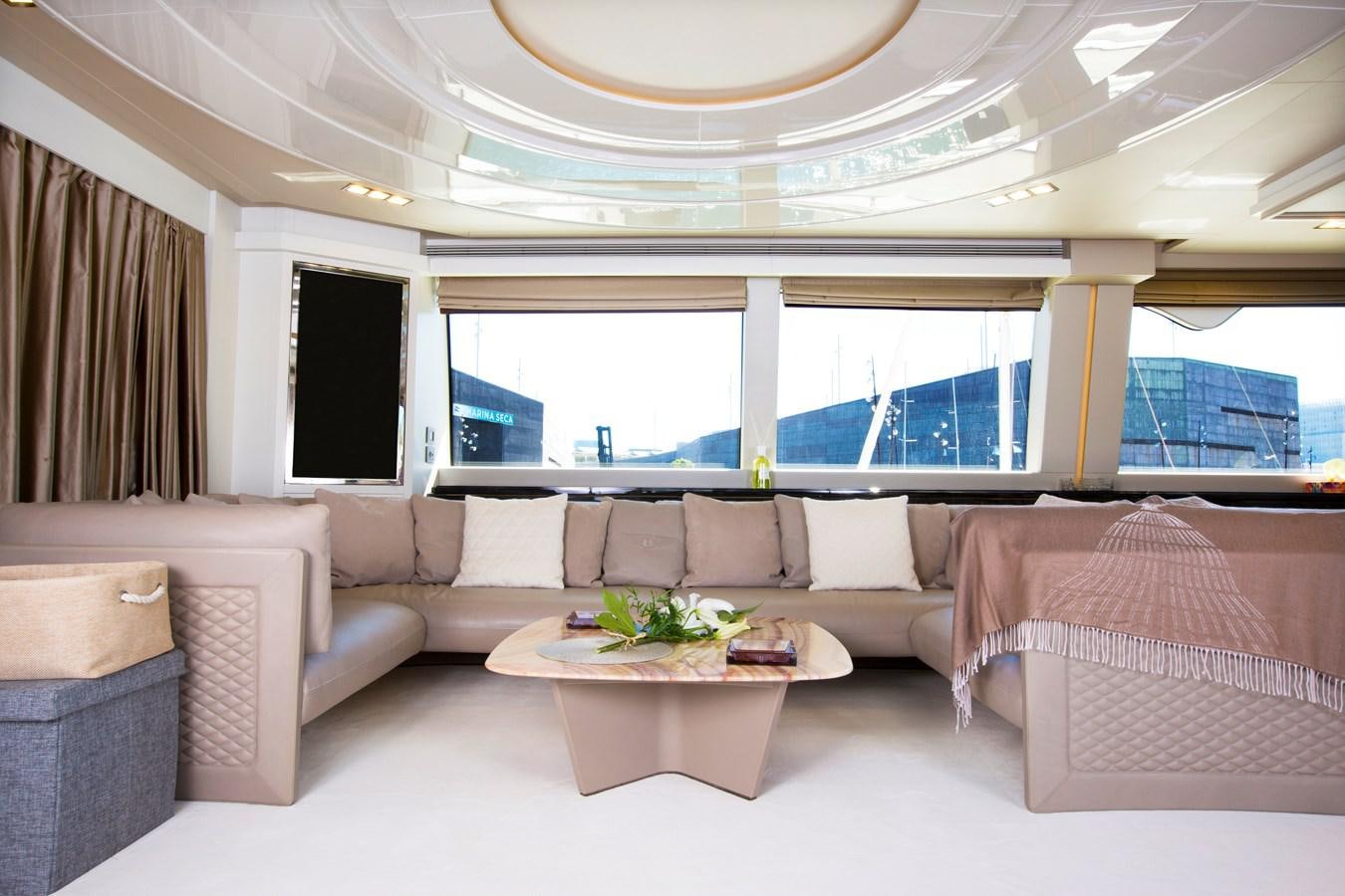 a living room with a couch and a table aboard SONNY II Yacht for Sale