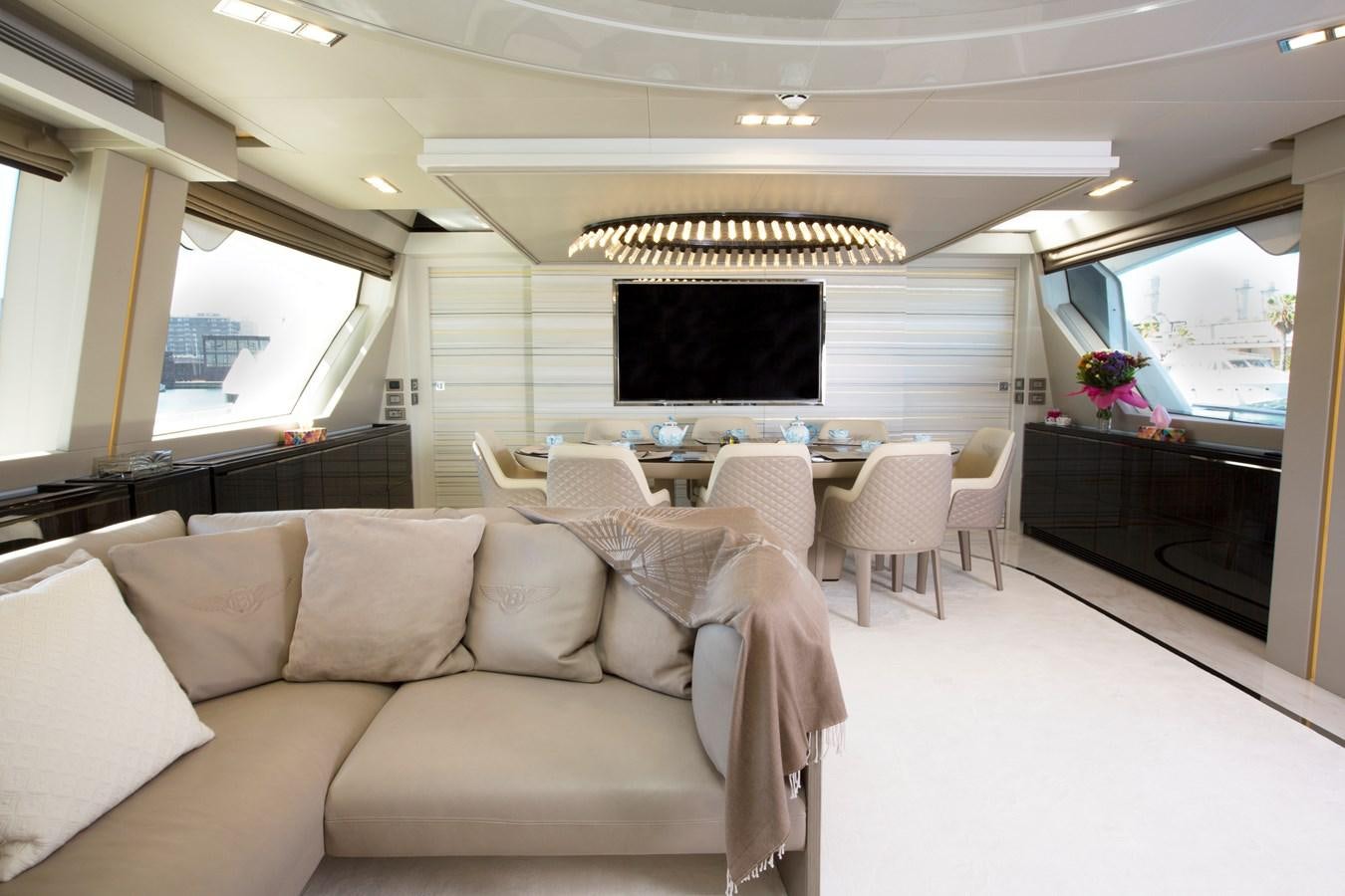 a living room with a large television aboard SONNY II Yacht for Sale