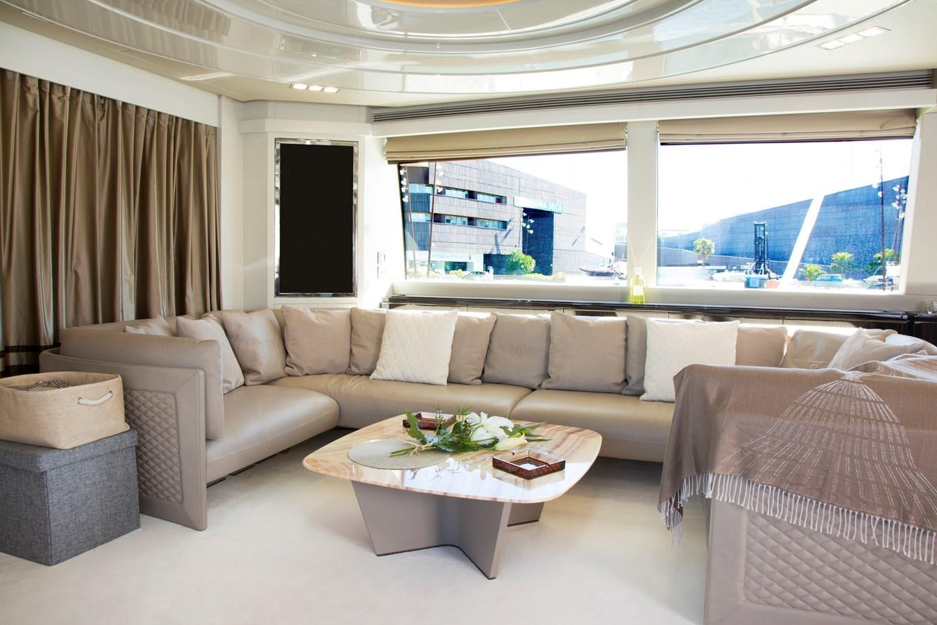 a living room with a couch and a table aboard SONNY II Yacht for Sale