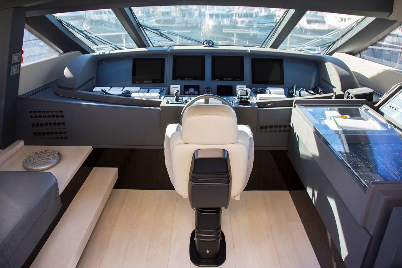 a white chair in a car aboard SONNY II Yacht for Sale