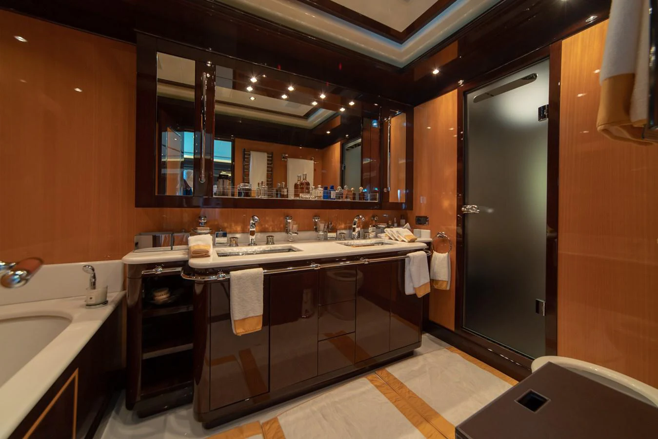 a bathroom with a large mirror aboard SAMHAN Yacht for Sale