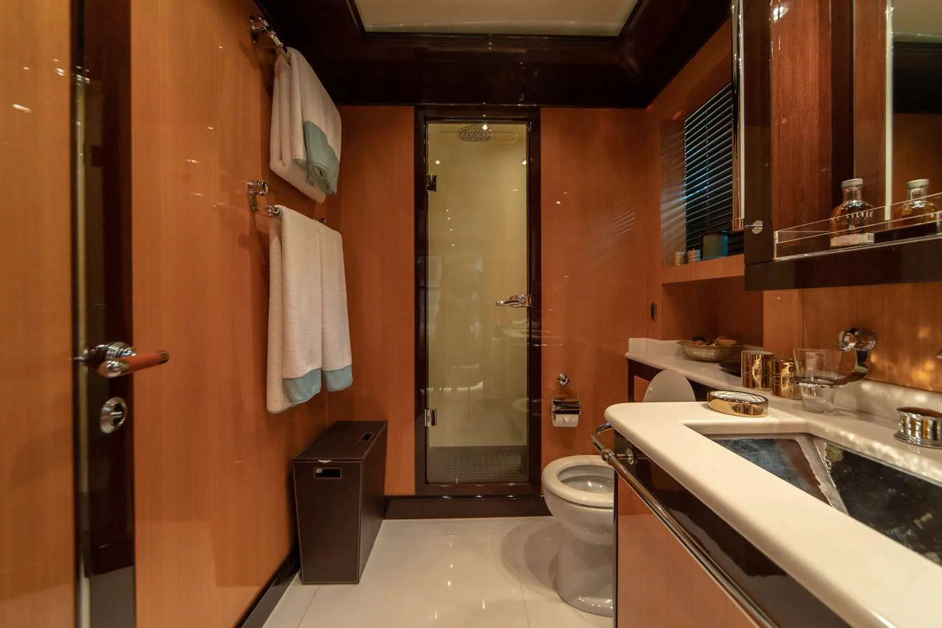 a bathroom with a sink toilet and a shower unit aboard SAMHAN Yacht for Sale