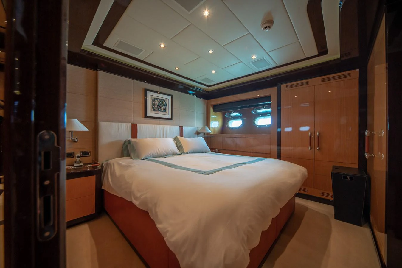 a room with a bed and cabinets aboard SAMHAN Yacht for Sale