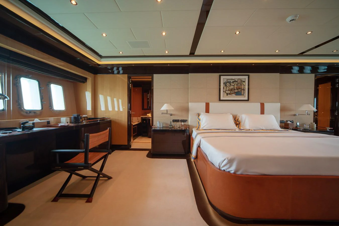 a room with a bed and desk aboard SAMHAN Yacht for Sale