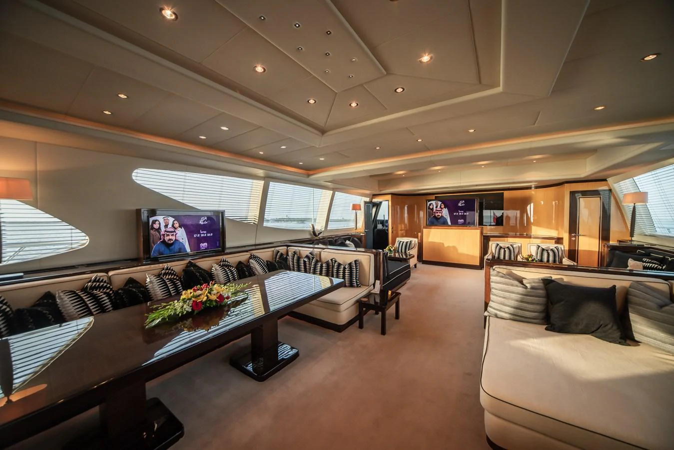 a living room with a large screen aboard SAMHAN Yacht for Sale