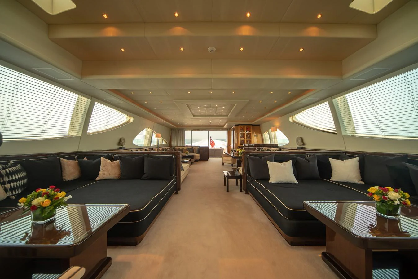 a living room with a couch and a table aboard SAMHAN Yacht for Sale