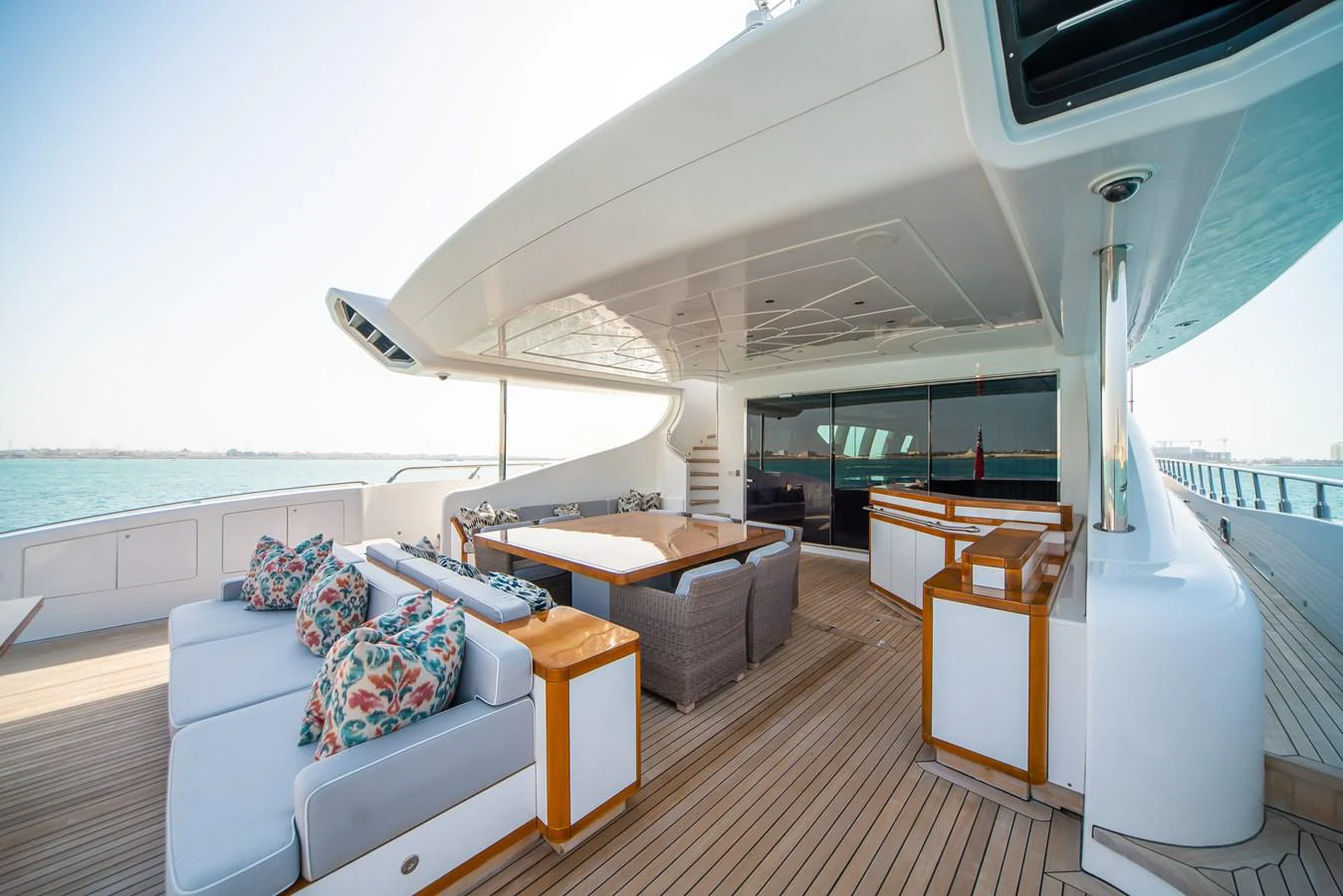 a room with a couch and a table and a large window aboard SAMHAN Yacht for Sale