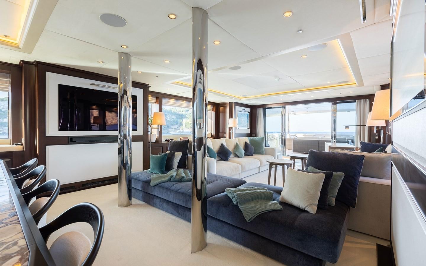 a large living room with a pool table and a large pool table aboard MAXIMILIAN MMIV Yacht for Charter