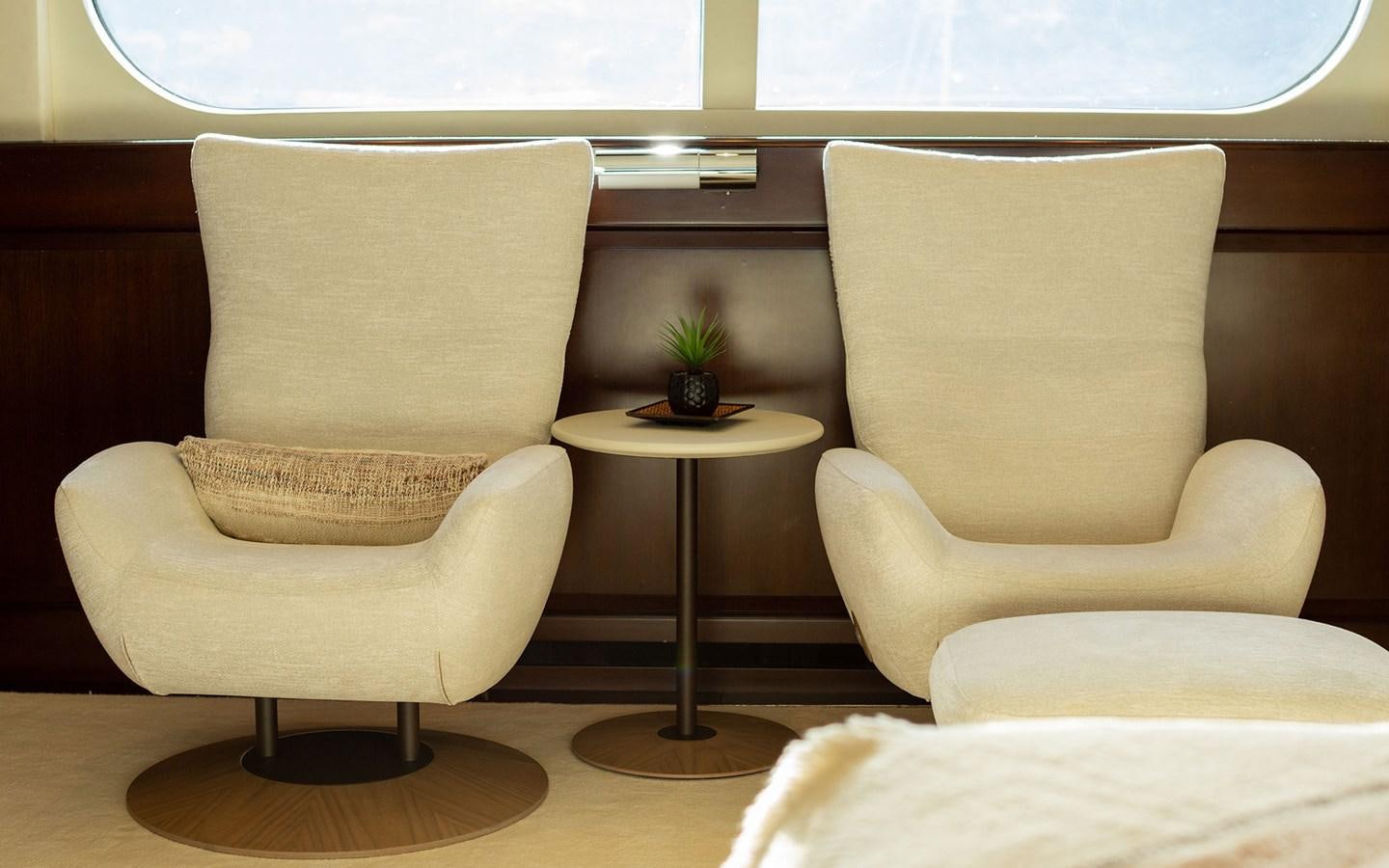a room with couches and a coffee table aboard MAXIMILIAN MMIV Yacht for Charter