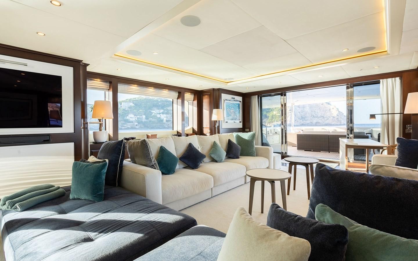 a living room with a large window aboard MAXIMILIAN MMIV Yacht for Charter