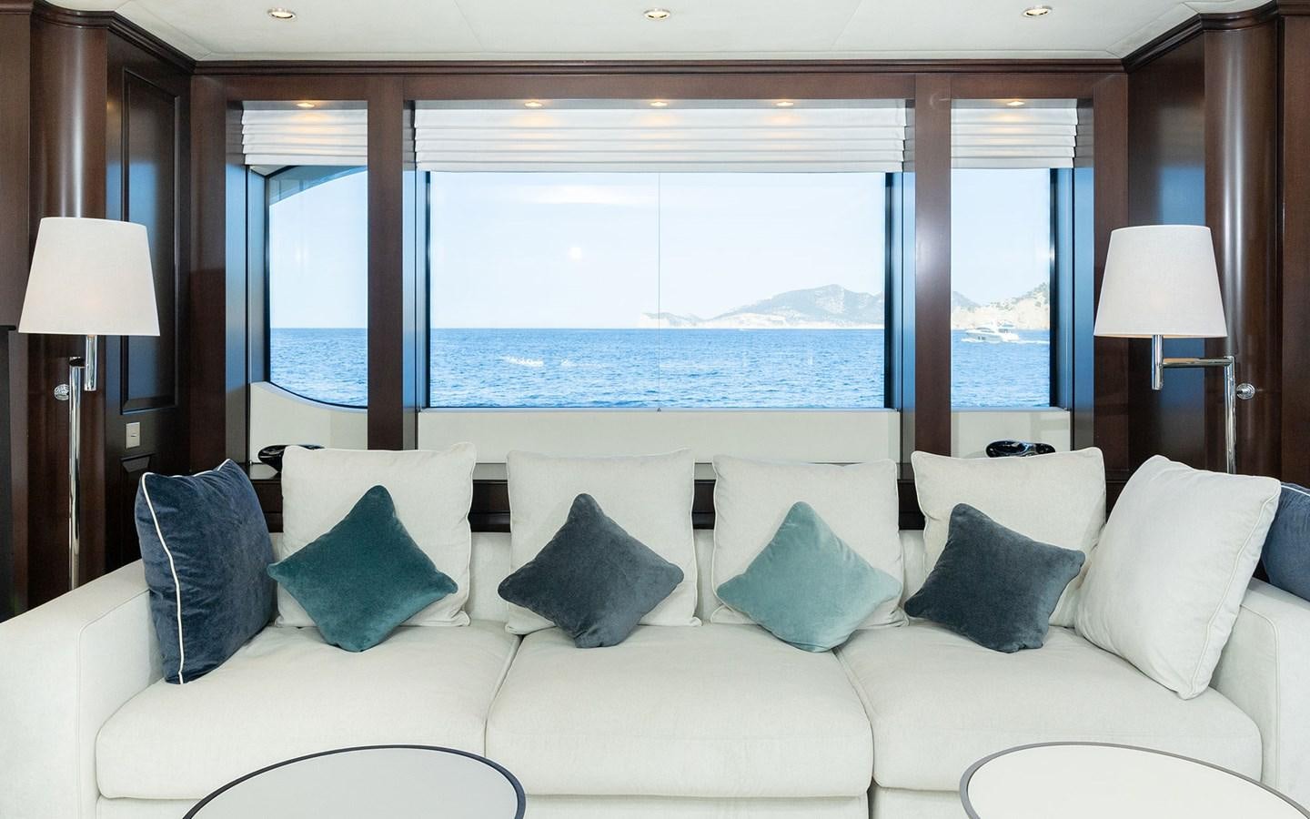 a large white sofa in a room aboard MAXIMILIAN MMIV Yacht for Charter