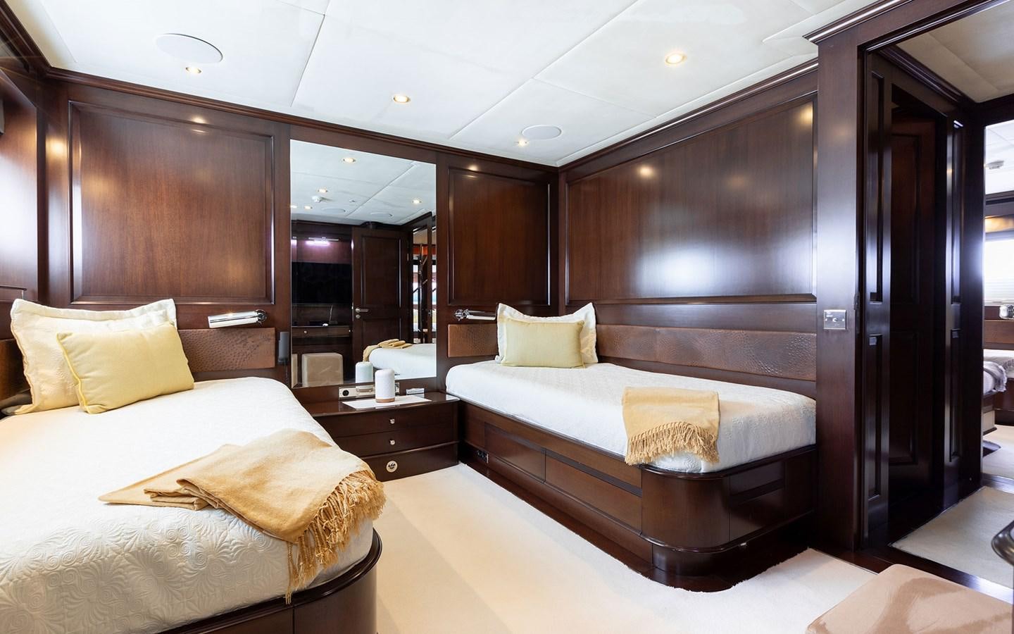 a hotel room with two beds aboard MAXIMILIAN MMIV Yacht for Charter
