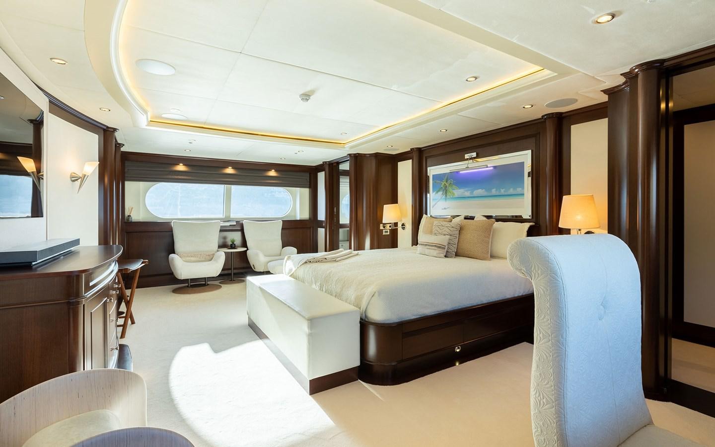 a hotel room with a bed and a tv aboard MAXIMILIAN MMIV Yacht for Sale