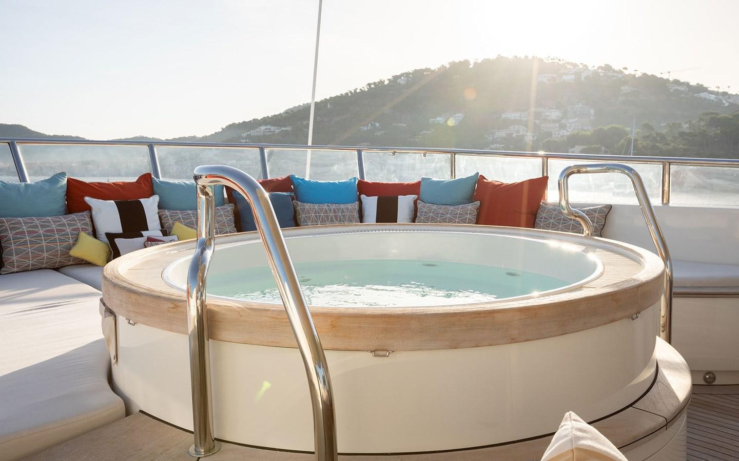 a bed with a pool aboard MAXIMILIAN MMIV Yacht for Charter