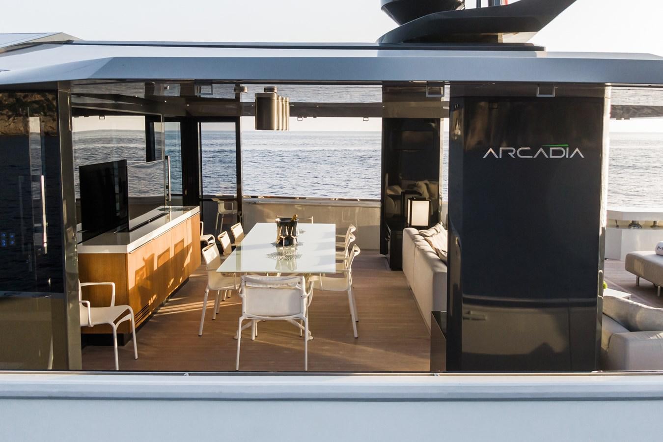 a room with a table and chairs aboard MILU' Yacht for Sale