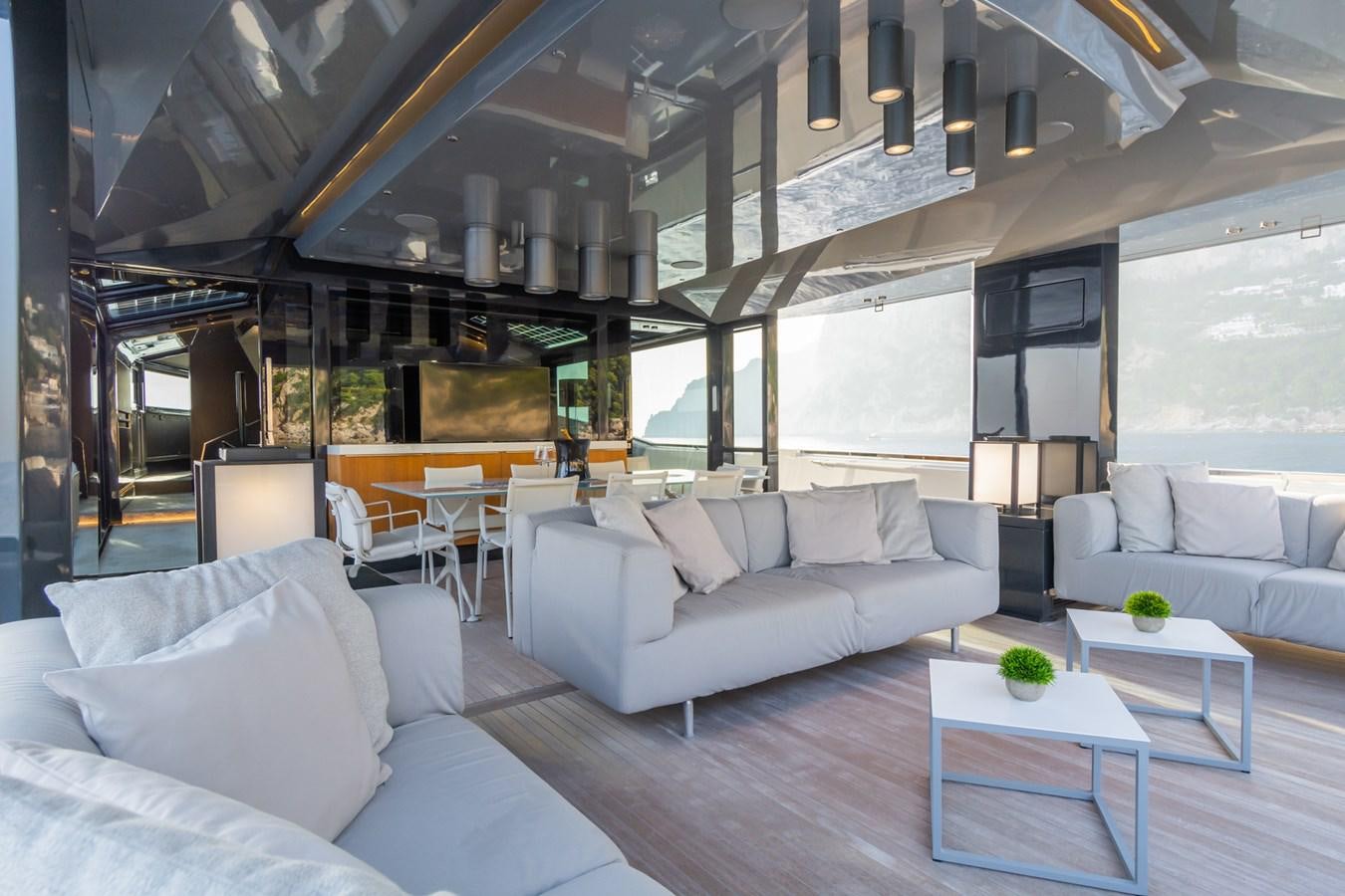 a living room with a couch and a table aboard MILU' Yacht for Sale