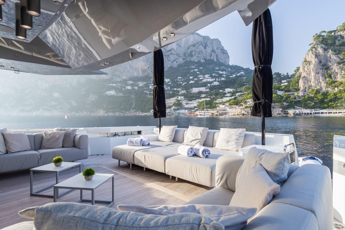 a living room with a large window aboard MILU' Yacht for Sale