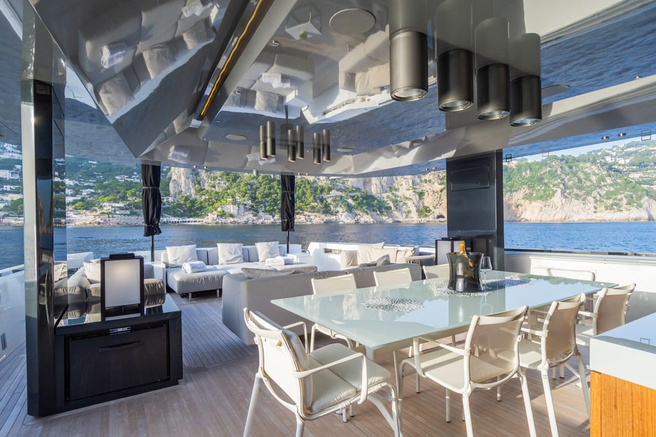 a room with a table chairs and a laptop aboard MILU' Yacht for Sale