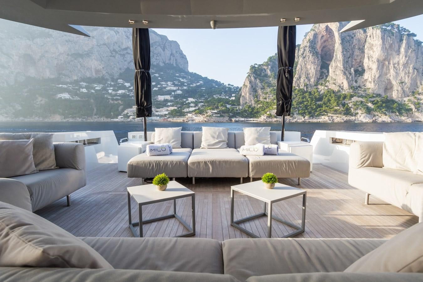 a living room with a large window aboard MILU' Yacht for Sale