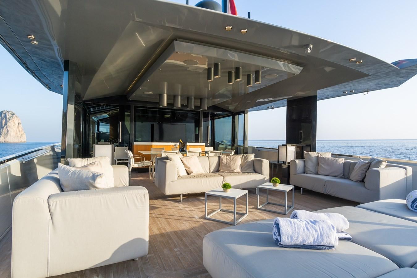 a living room with a large window aboard MILU' Yacht for Sale