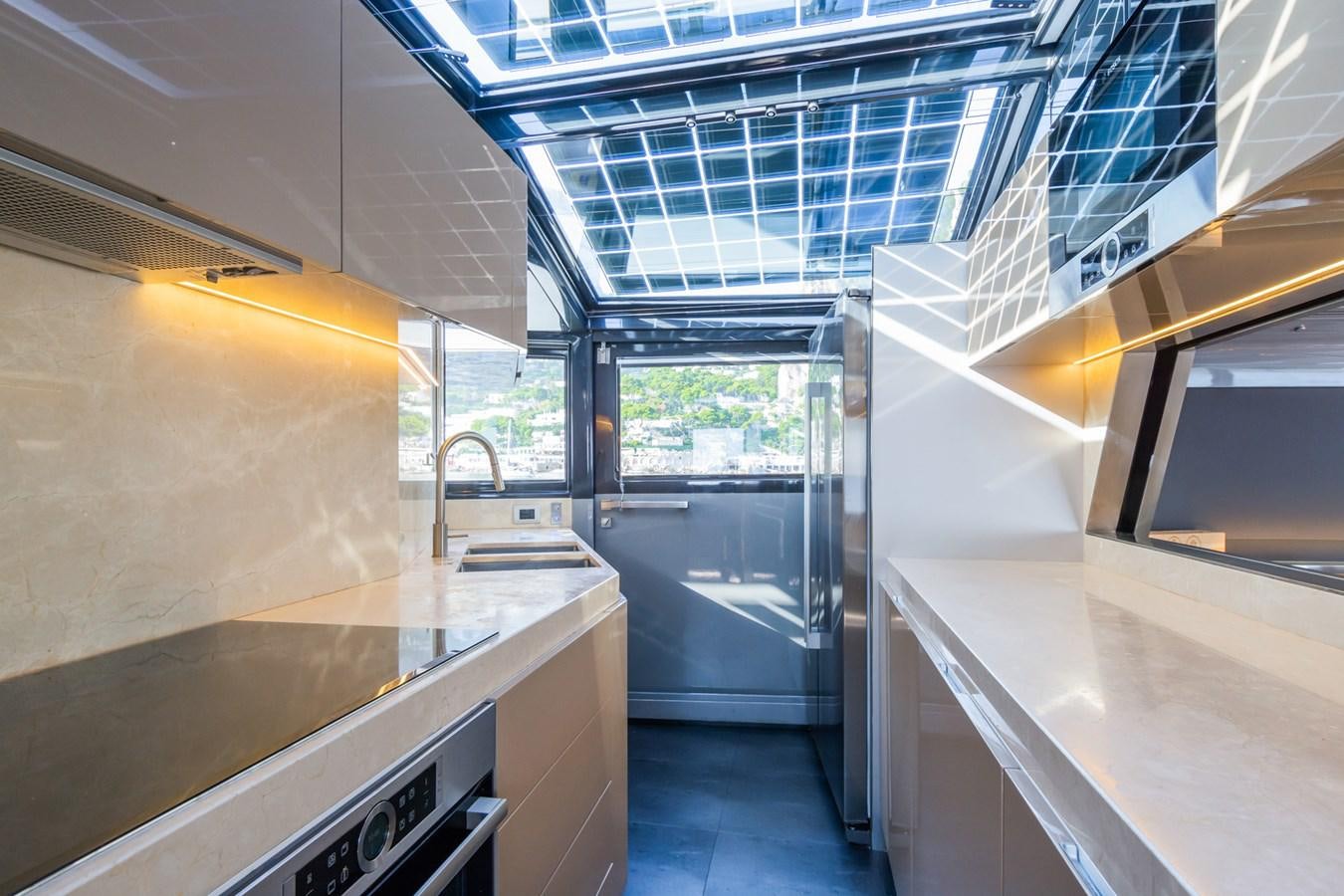 a kitchen with stainless steel appliances aboard MILU' Yacht for Sale