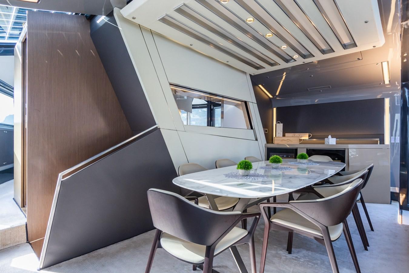 a room with a table and chairs aboard MILU' Yacht for Sale