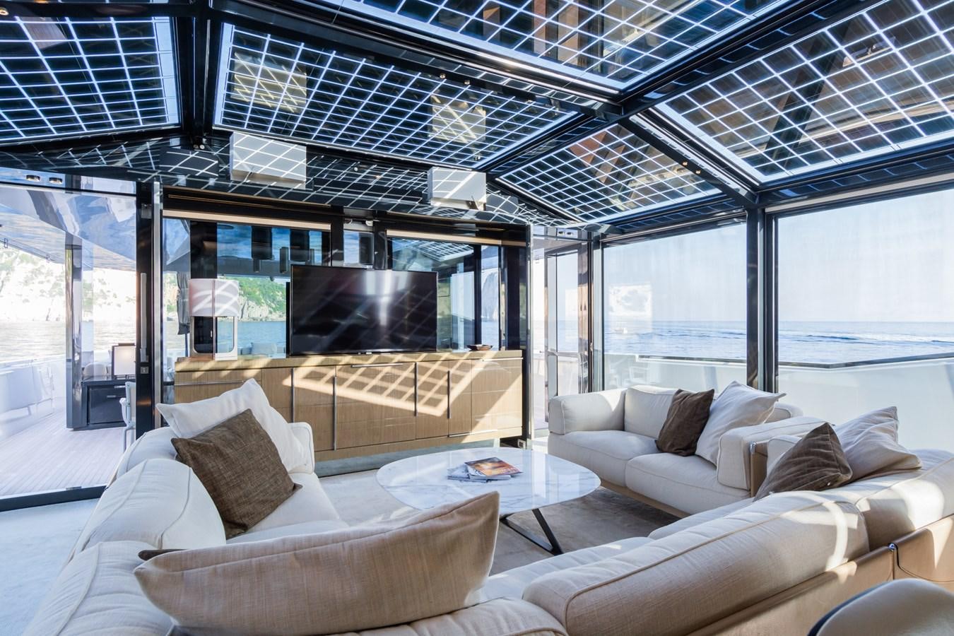a living room with a large window aboard MILU' Yacht for Sale