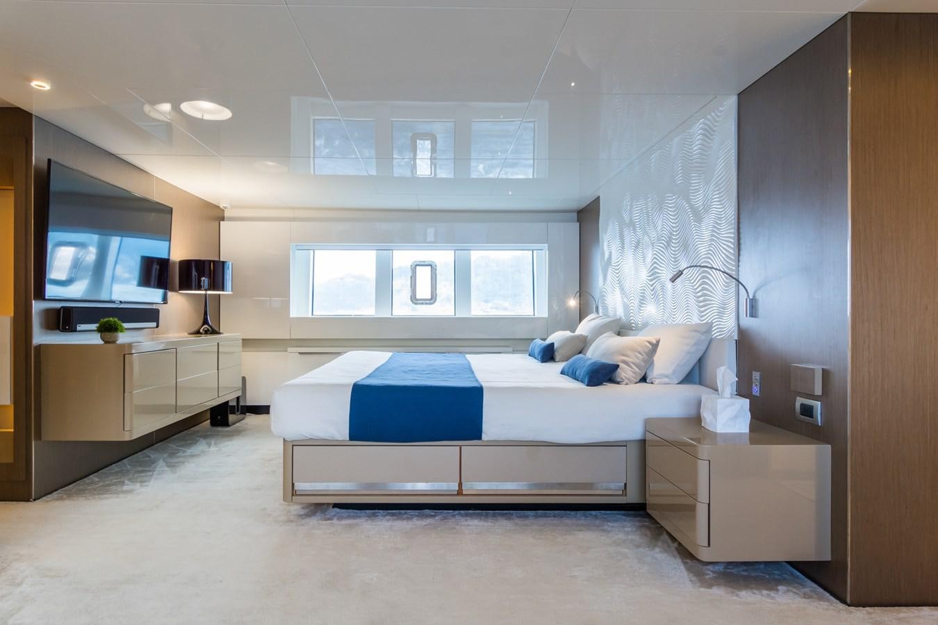 a bedroom with a bed and a tv aboard MILU' Yacht for Sale