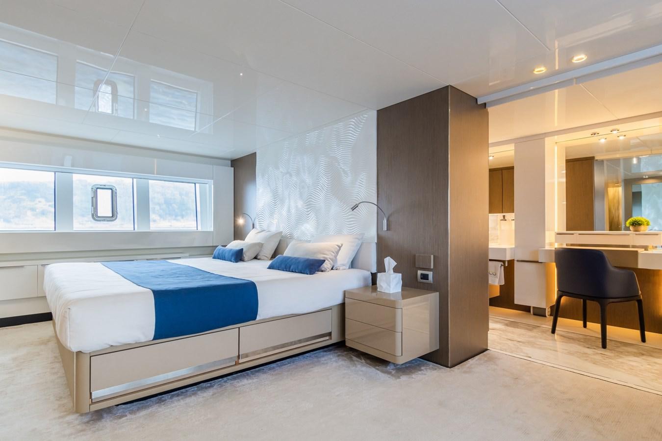 a bedroom with a bed and a desk aboard MILU' Yacht for Sale