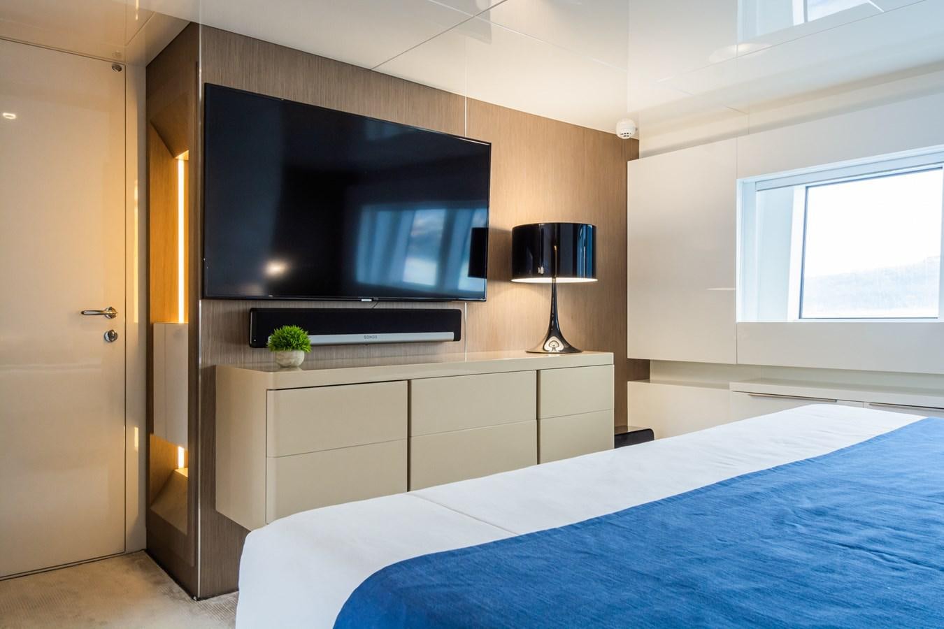 a bedroom with a large television aboard MILU' Yacht for Sale