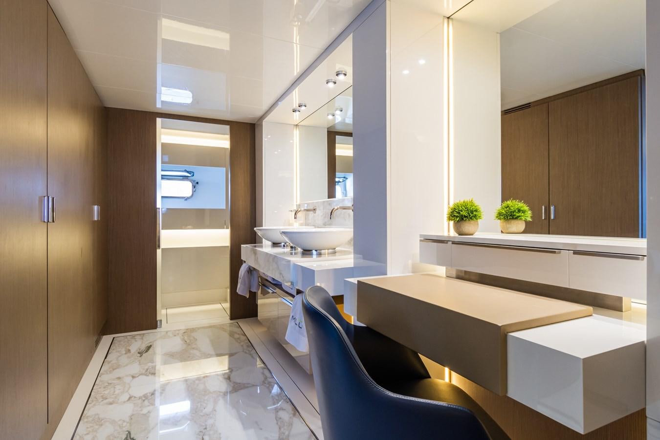 a modern bathroom with a large glass shower aboard MILU' Yacht for Sale