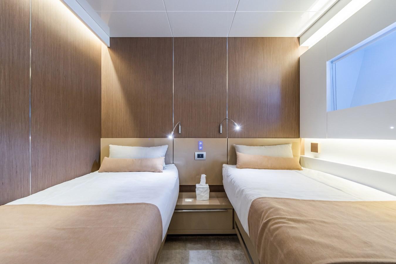 a room with two beds aboard MILU' Yacht for Sale