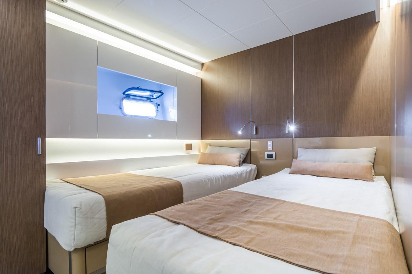 a room with a bed and a television aboard MILU' Yacht for Sale
