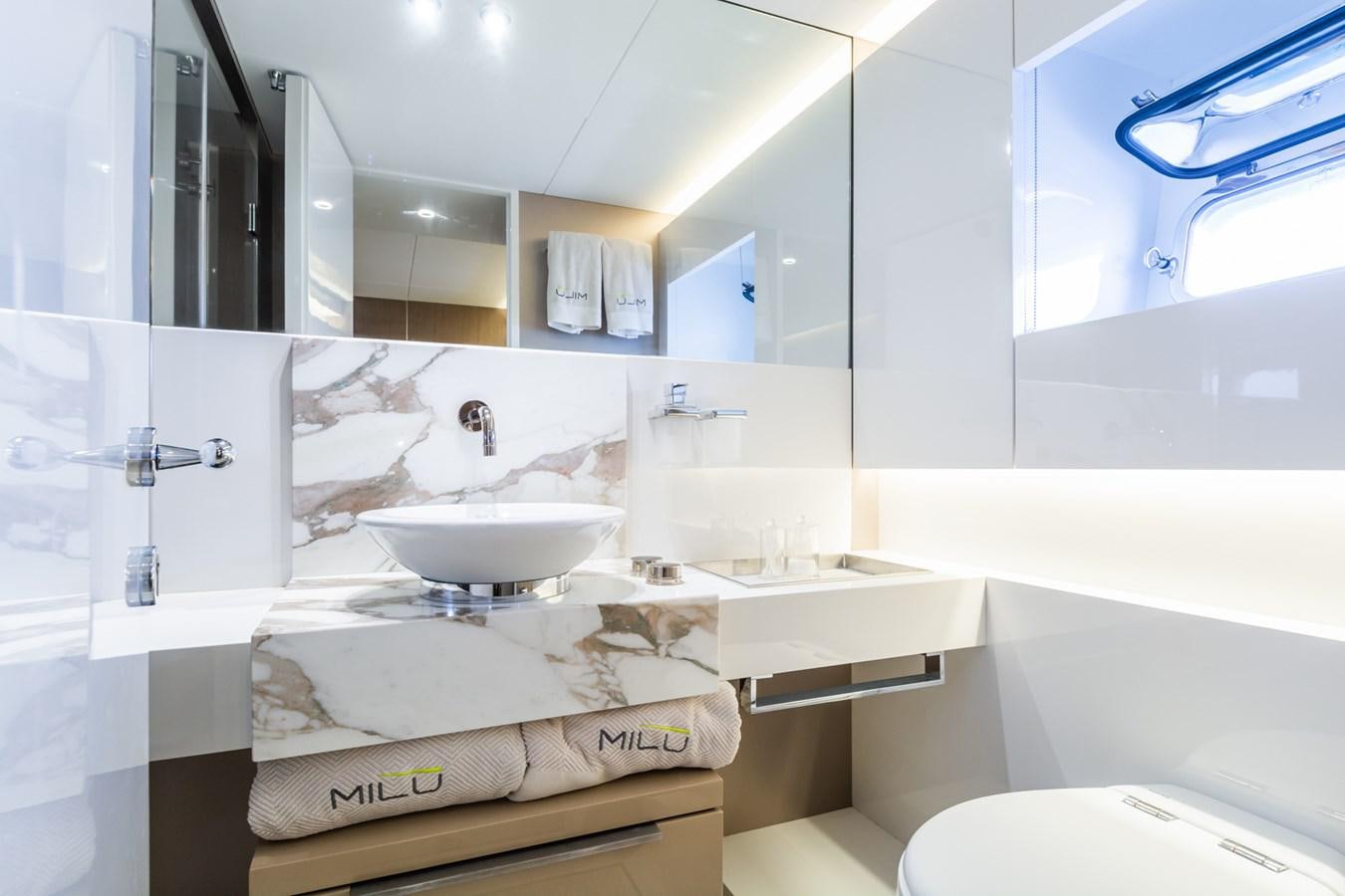 a bathroom with a sink and a mirror aboard MILU' Yacht for Sale