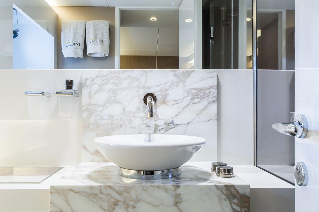 a bathroom with a sink and a mirror aboard MILU' Yacht for Sale