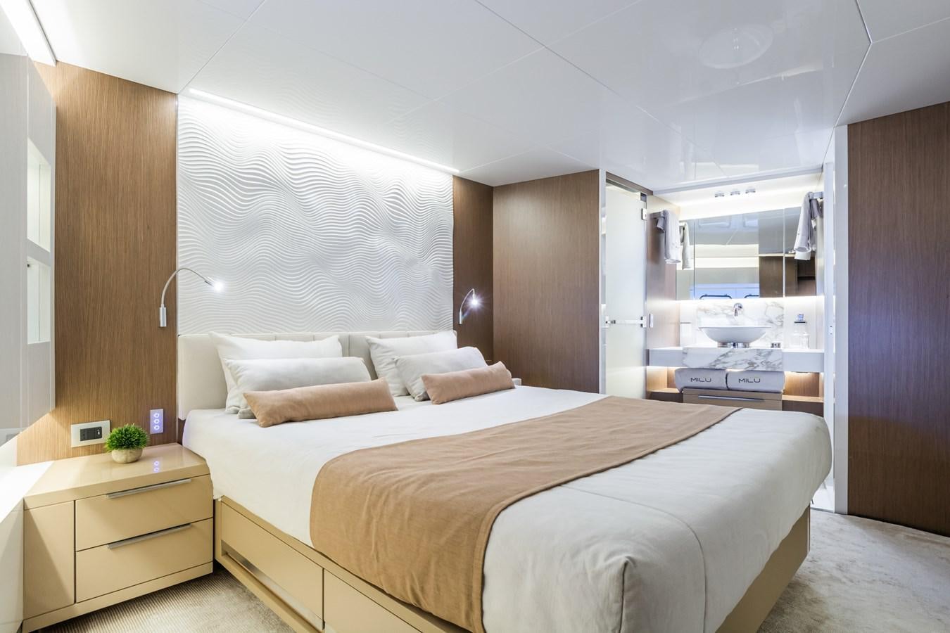 a bedroom with a bed and a desk aboard MILU' Yacht for Sale