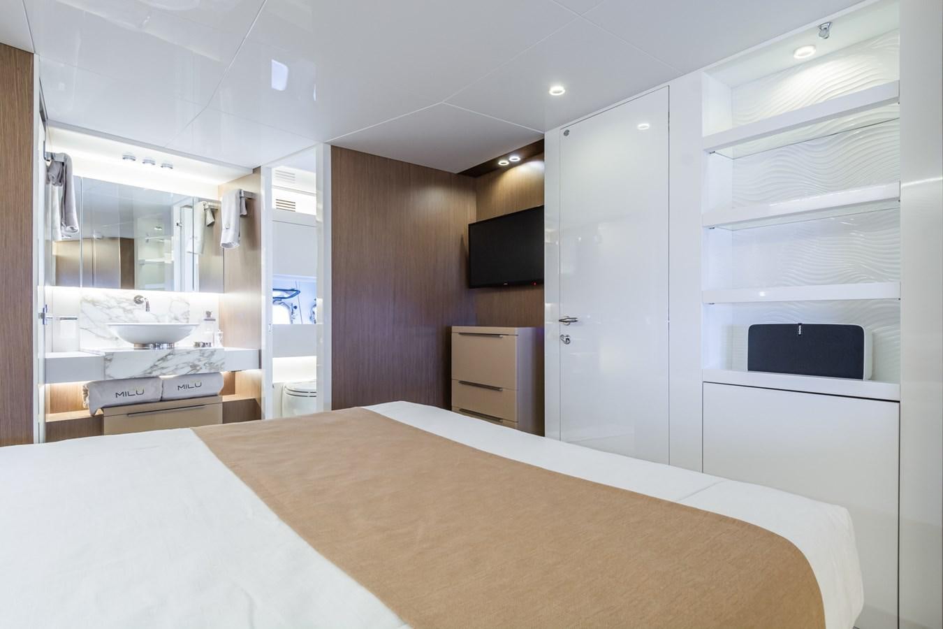 a kitchen with a large white table aboard MILU' Yacht for Sale