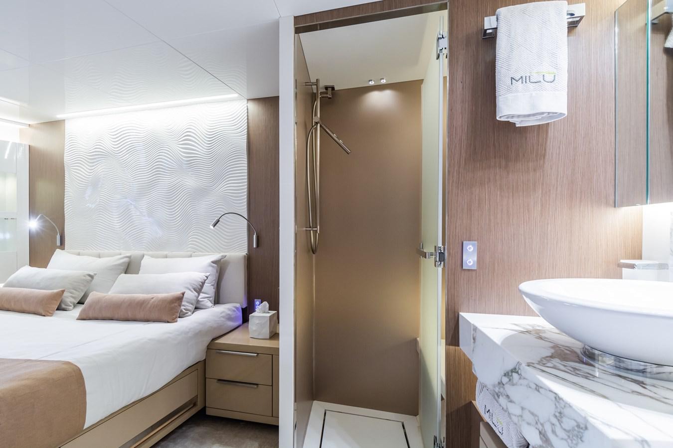 a bathroom with a bed and a sink aboard MILU' Yacht for Sale