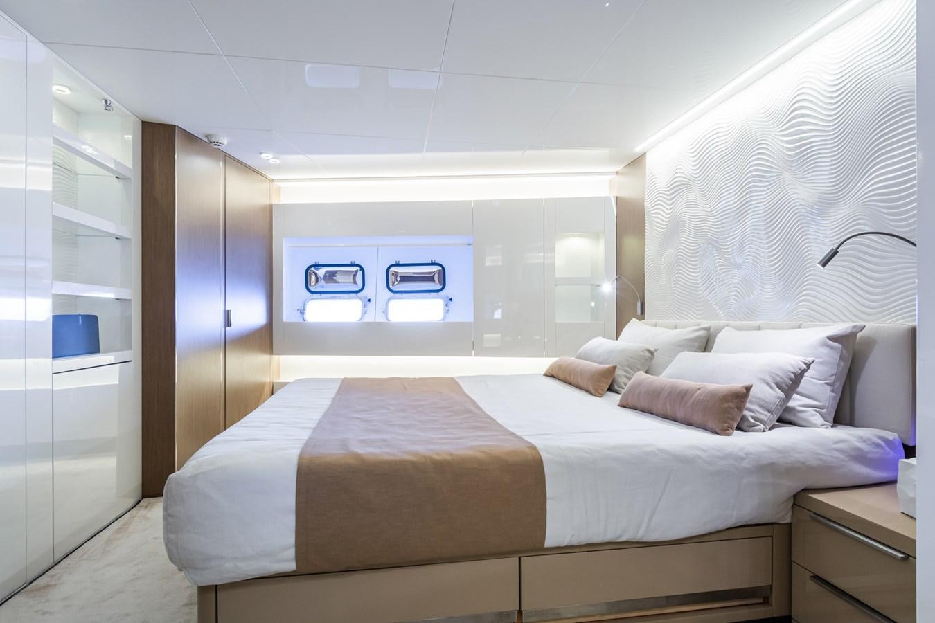 a bed in a room aboard MILU' Yacht for Sale