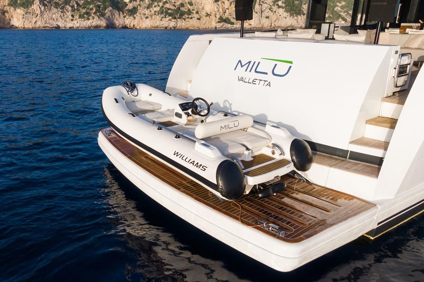 a white boat on the water aboard MILU' Yacht for Sale
