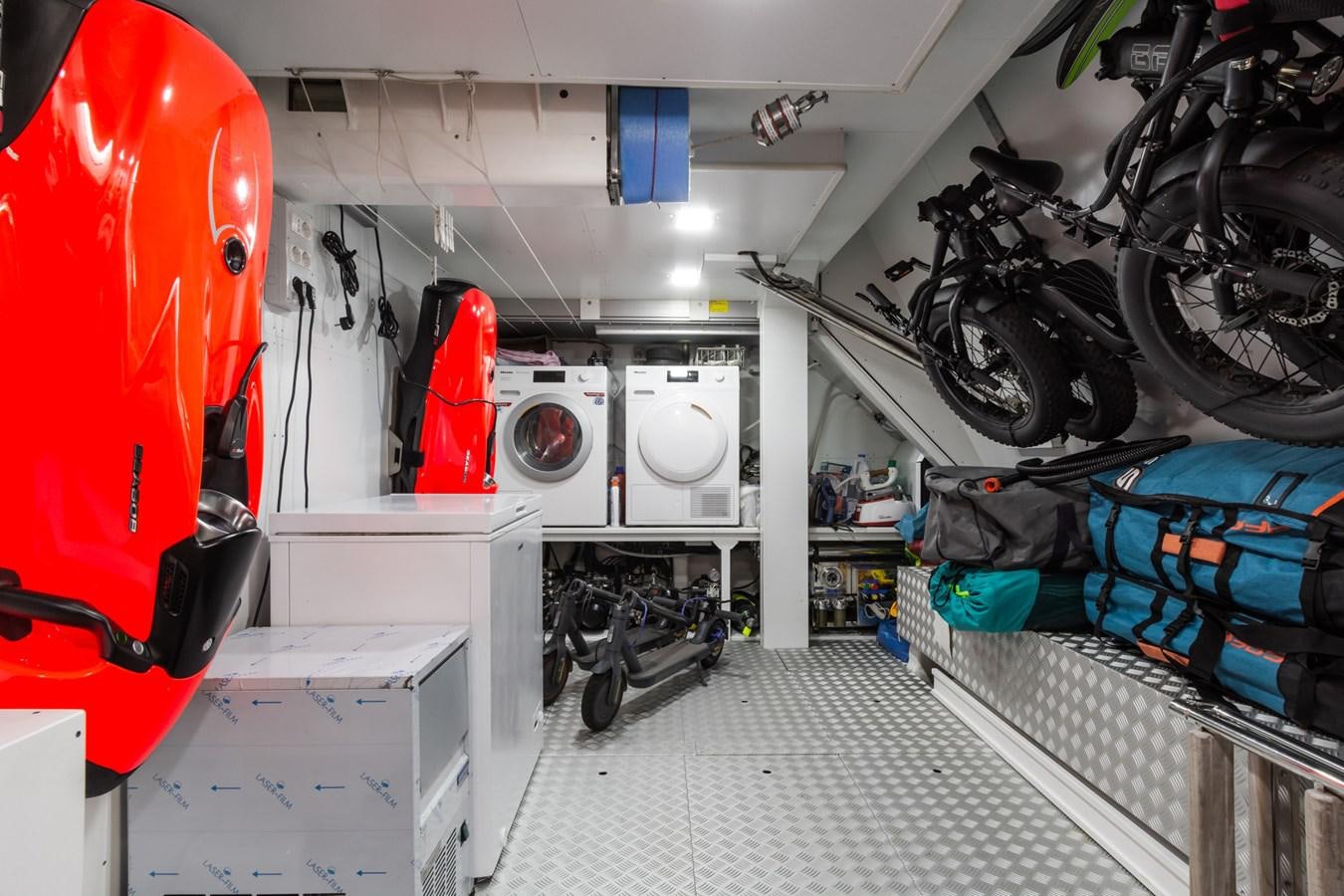 a room with a lot of bicycles and a rack of clothes aboard MILU' Yacht for Sale