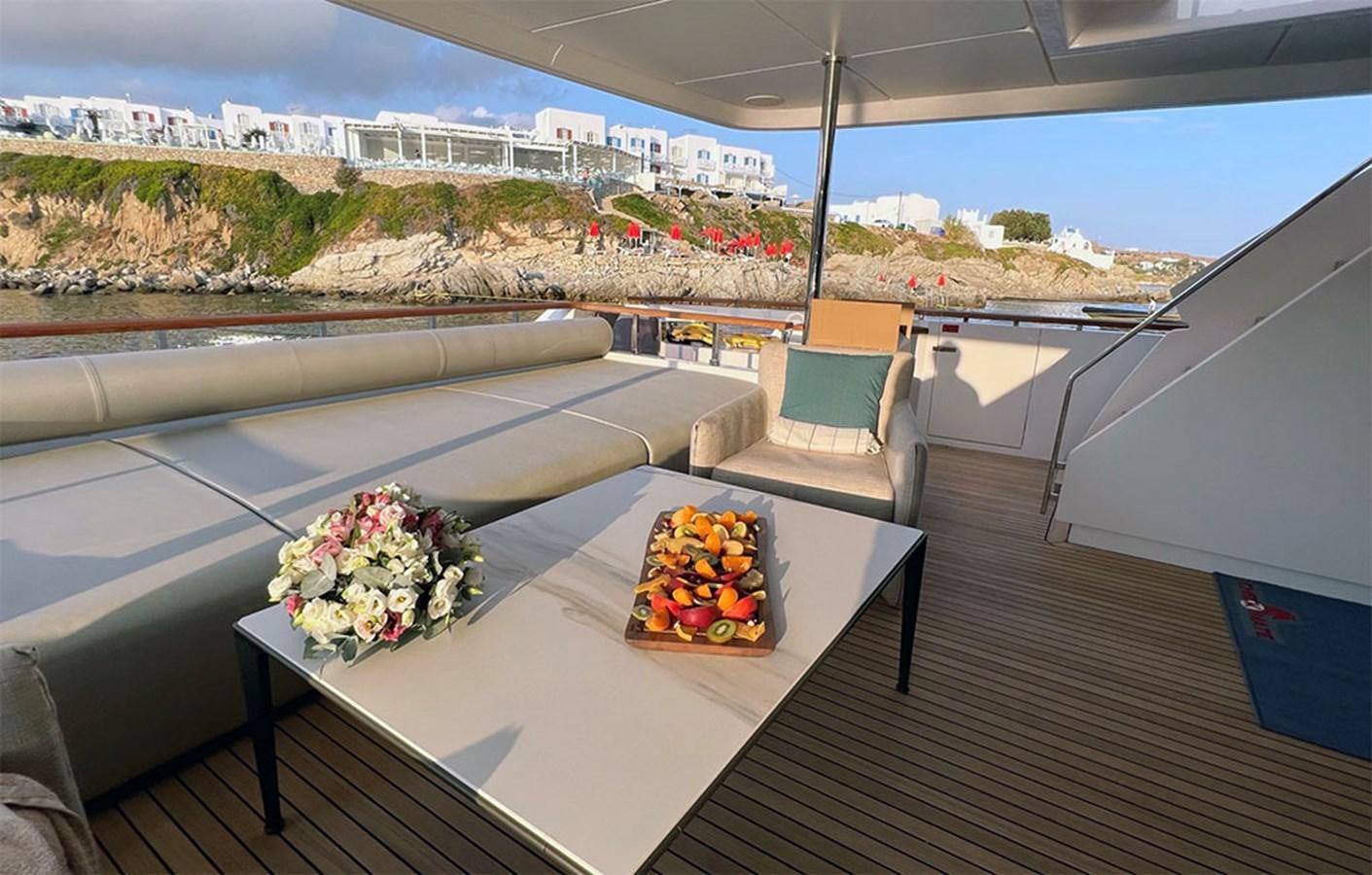 a table with a bouquet of flowers on it aboard CHECKMATE Yacht for Sale