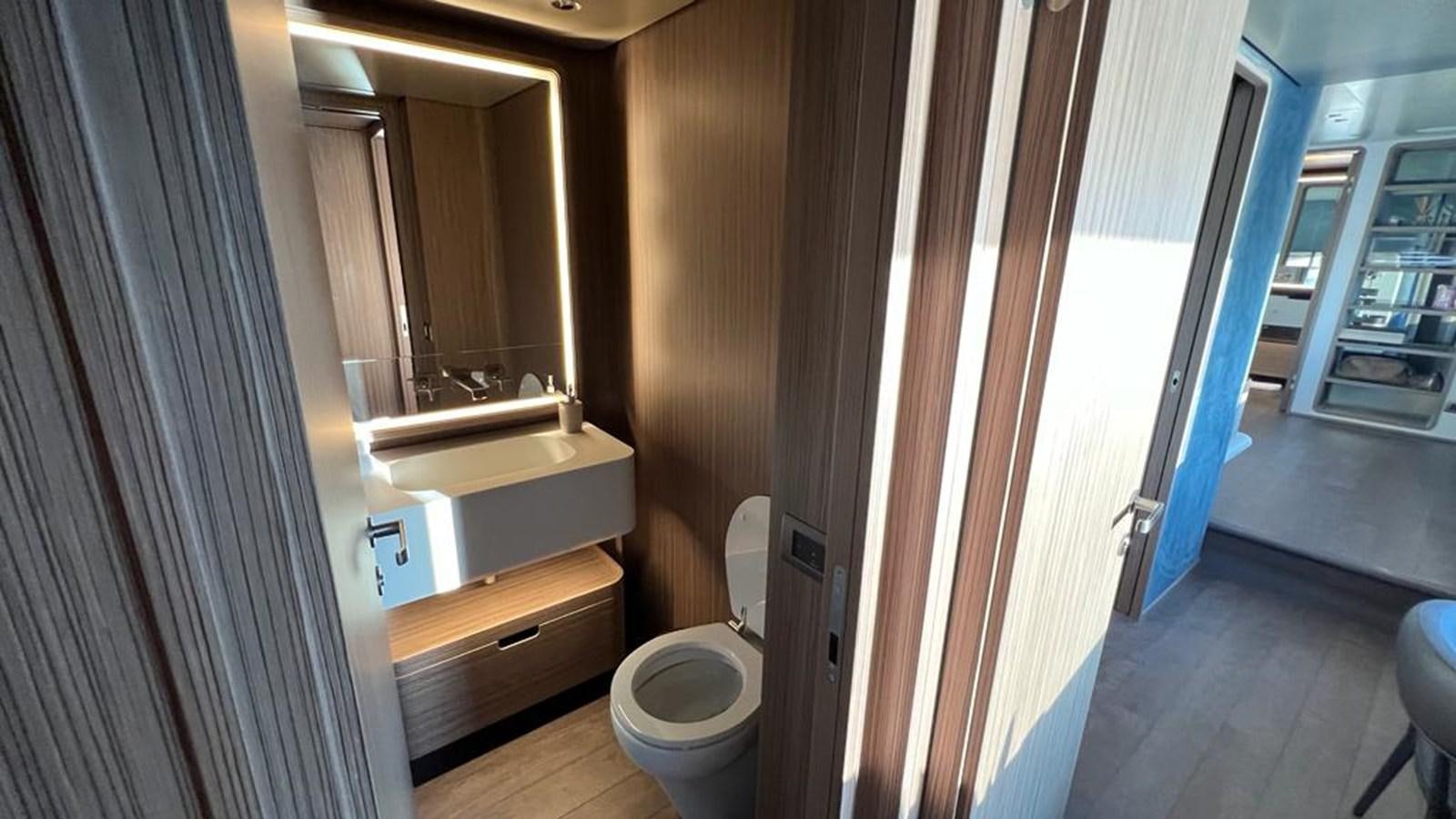 a bathroom with a sink and a toilet aboard CHECKMATE Yacht for Sale