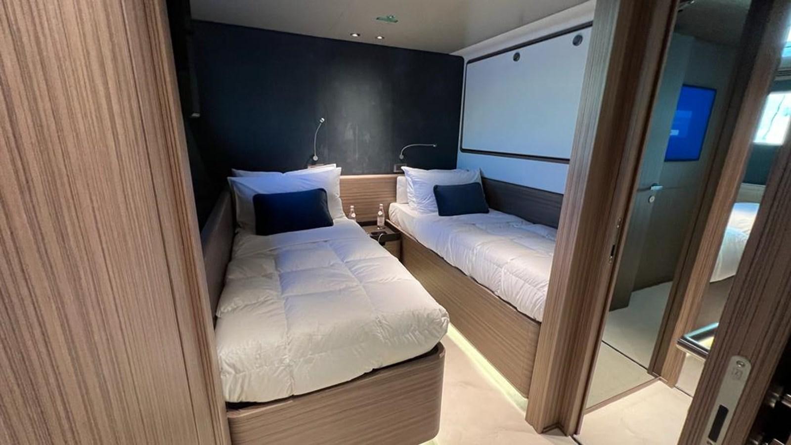 a room with a bed and a door aboard CHECKMATE Yacht for Sale