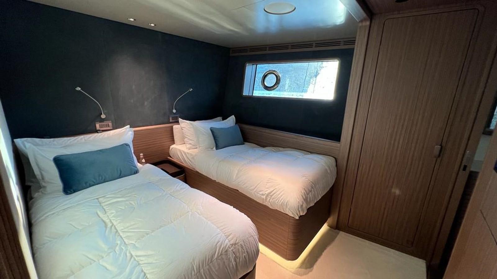 a room with two beds aboard CHECKMATE Yacht for Sale