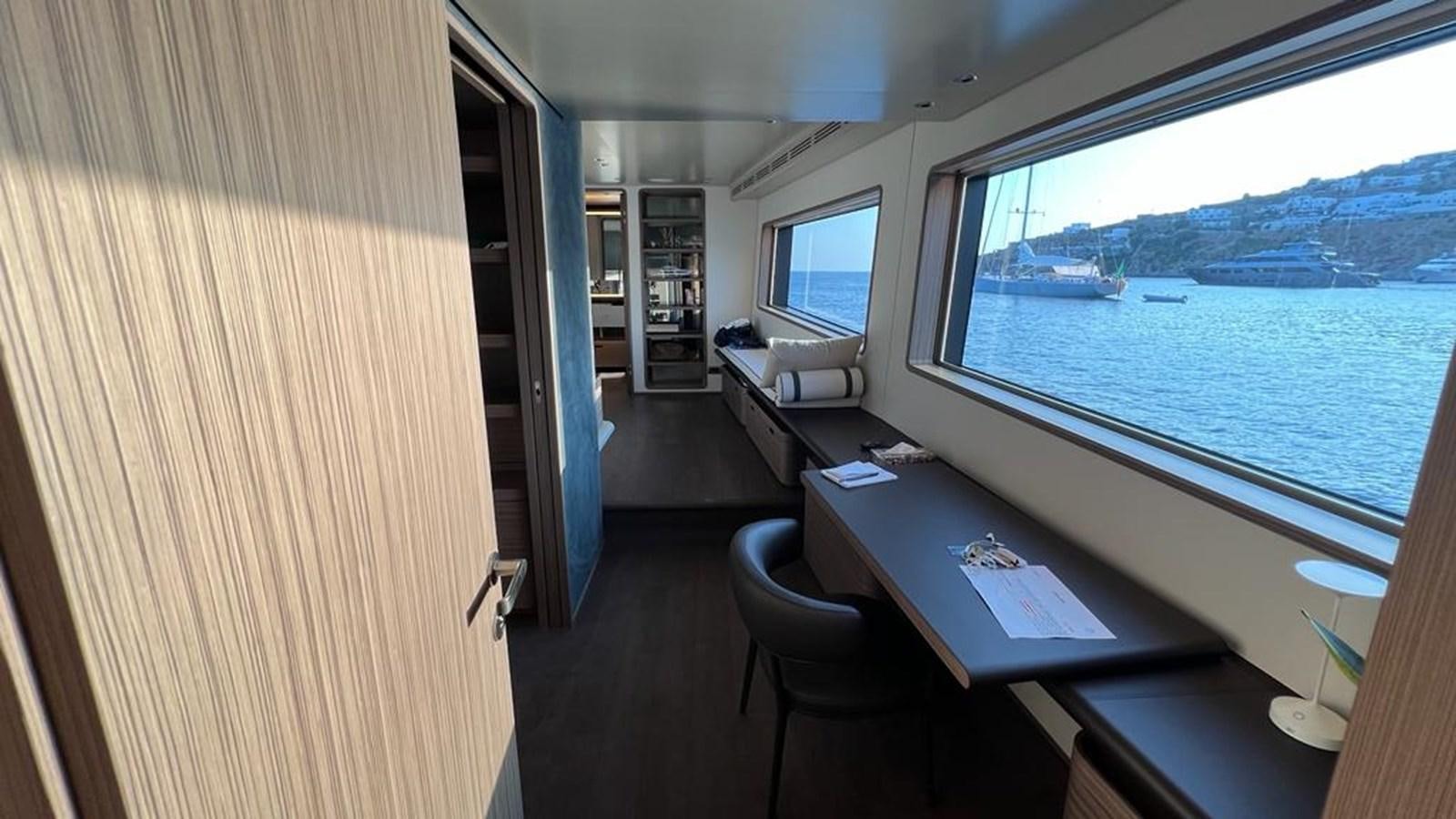 a room with a desk and a window aboard CHECKMATE Yacht for Sale