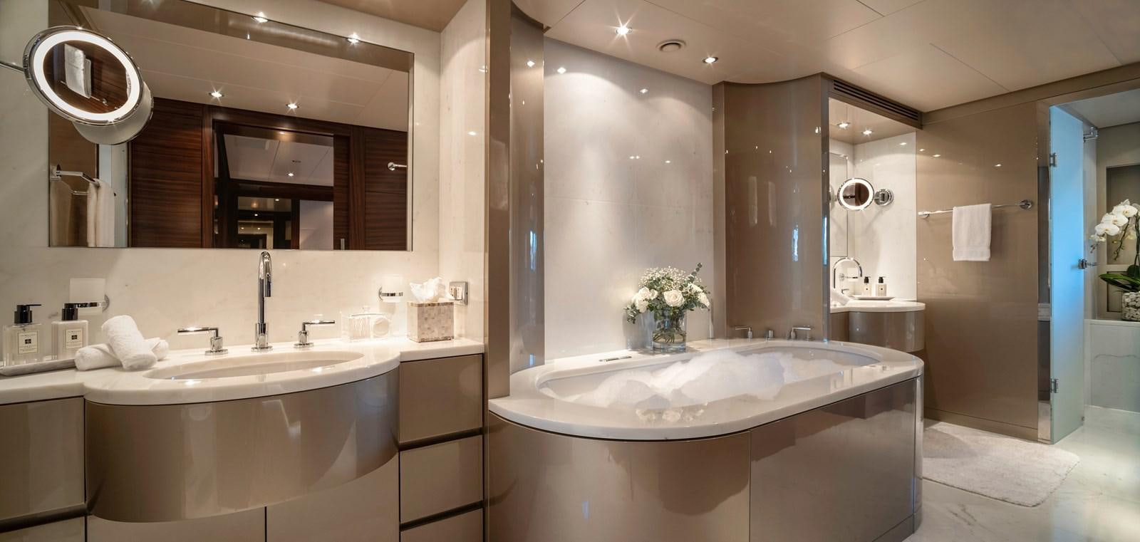 a bathroom with a large bathtub aboard ATLAS Yacht for Sale